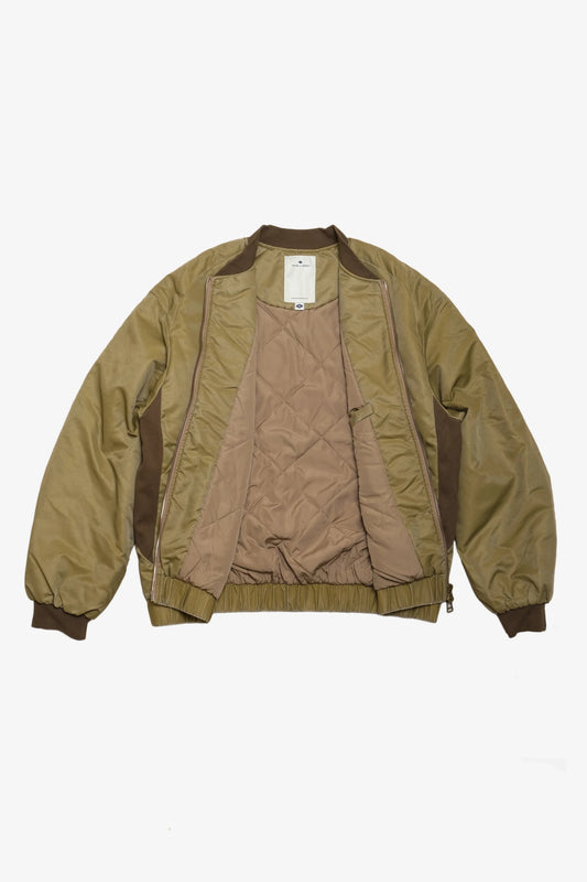 Military-inspired washed green bomber jacket with quilted interior lining, ribbed collar and cuffs, and relaxed fit for versatile menswear style.