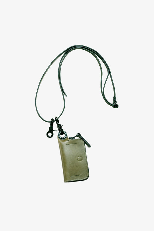 Green leather strap with black metal clasps attached to a small zippered pouch, designed for carrying essentials hands-free with a military-inspired utilitarian style.