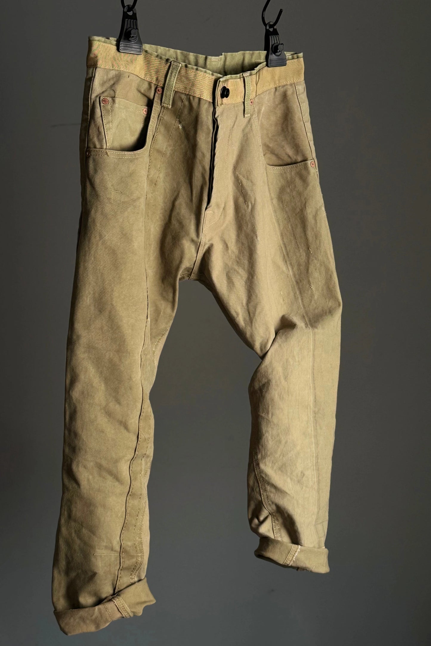 Front view of army carrot pants on a hanger