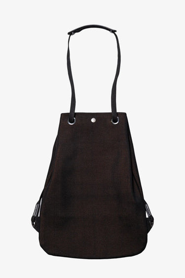 Front view of a black knitted Apple Picker backpack with black strap