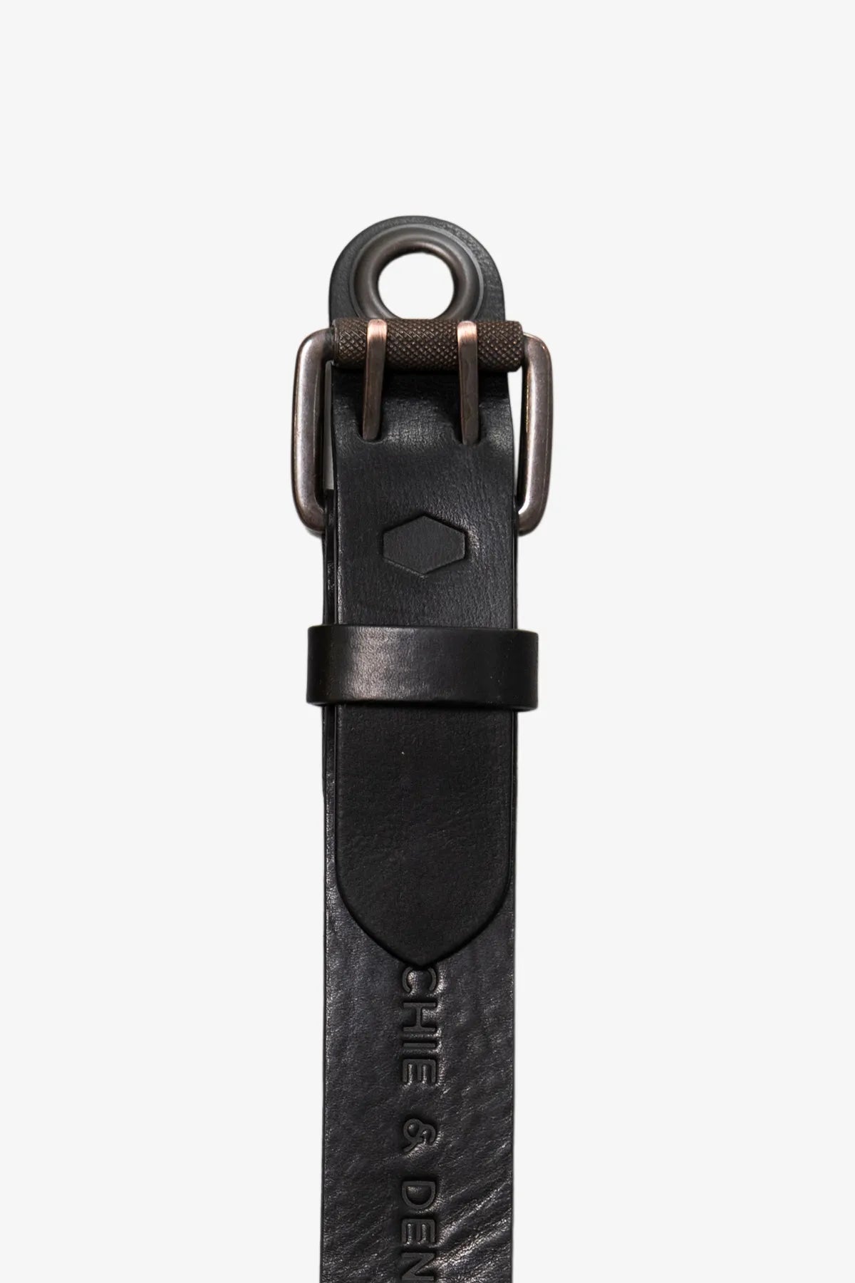 Close-up top view of a black leather belt with a double-prong buckle