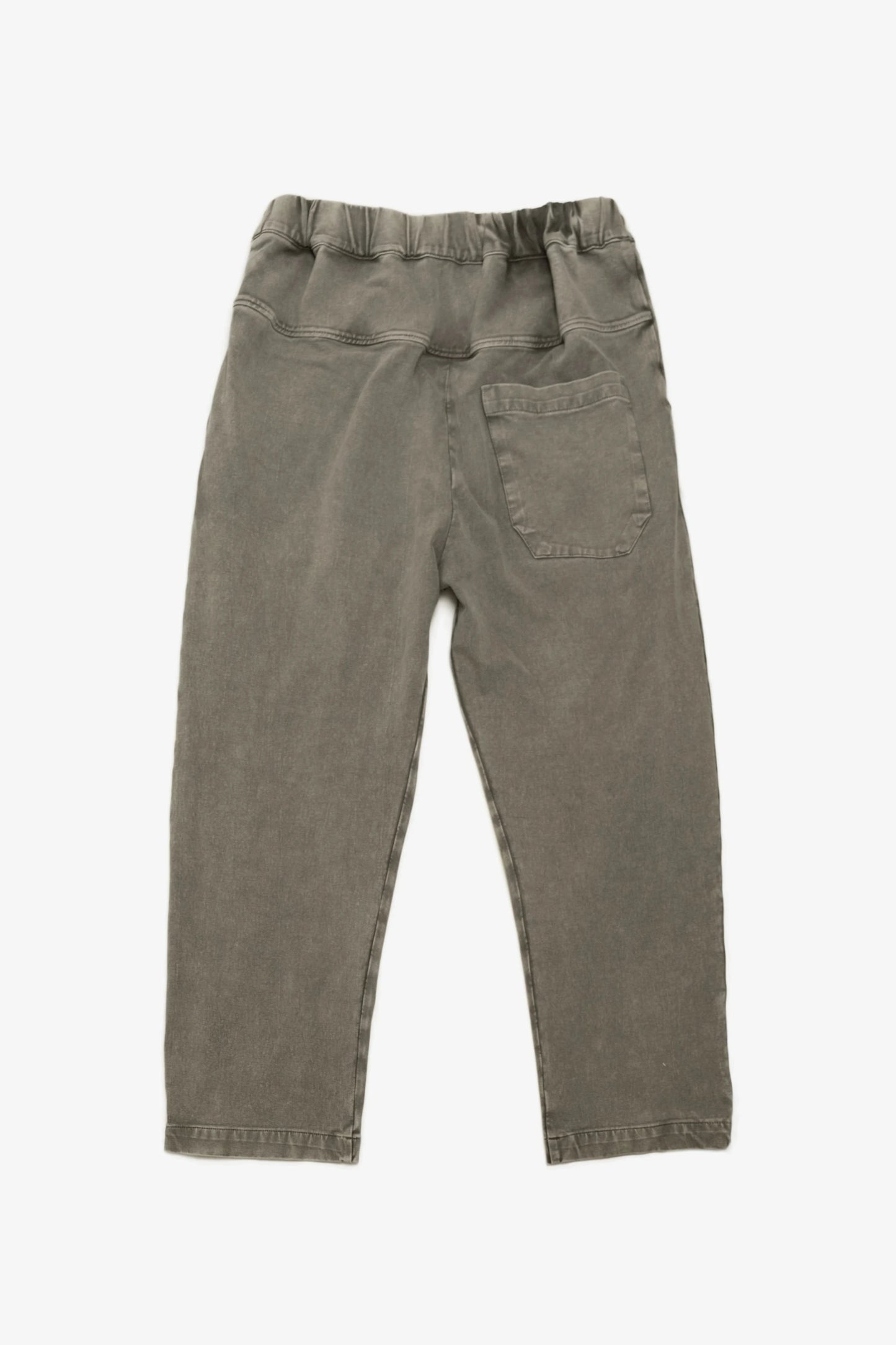 Back view of relaxed fit pants made from soft double-knit fabric in muted coffee color, featuring an elastic waistband and a single rear patch pocket for utility-inspired menswear style.