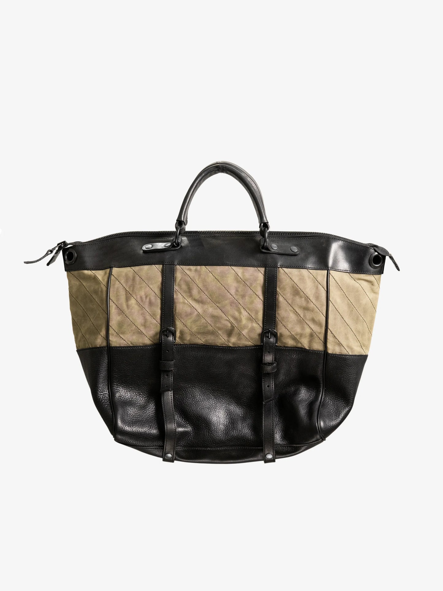 Large handcrafted weekend bag featuring olive green quilted fabric combined with black leather panels, double top handles, and adjustable buckle straps for a utility-inspired look.